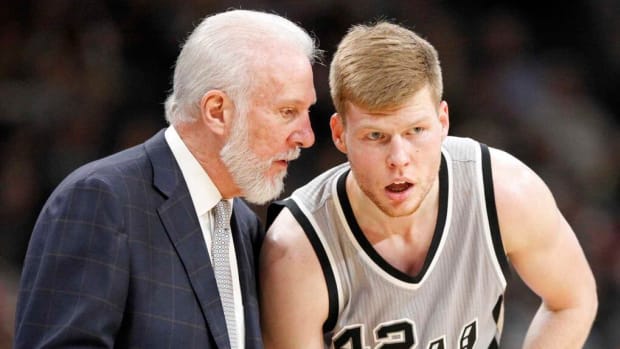 San Antonio Spurs head coach Gregg Popovich talks with Davis Bertans during second half action against the Utah Jazz Sunday April 2, 2017 at the AT&amp;T Center. The Spurs won 109-103.