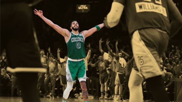 Boston Celtics forward Jayson Tatum celebrating a three pointer