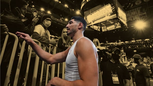Enes Kanter-Freedom taking selfies with fans after a game