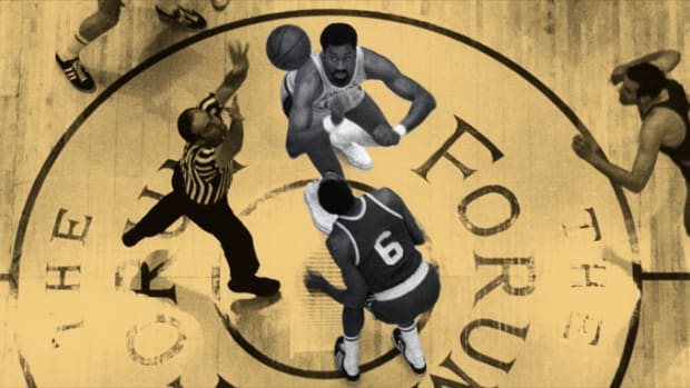 Los Angeles Lakers center Wilt Chamberlain battles Boston Celtics center Bill Russell