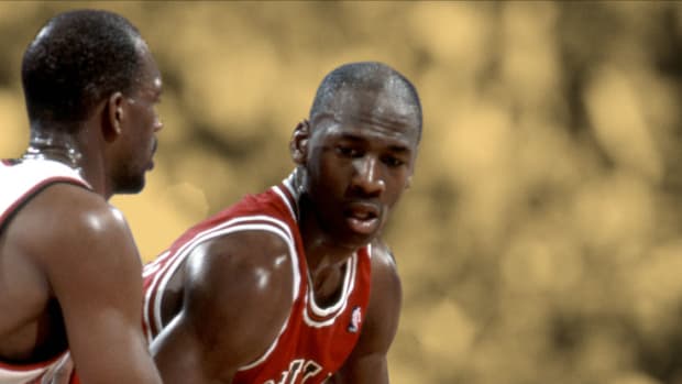 Chicago Bulls guard Michael Jordan is defended by Portland Trail Blazers guard Clyde Drexler