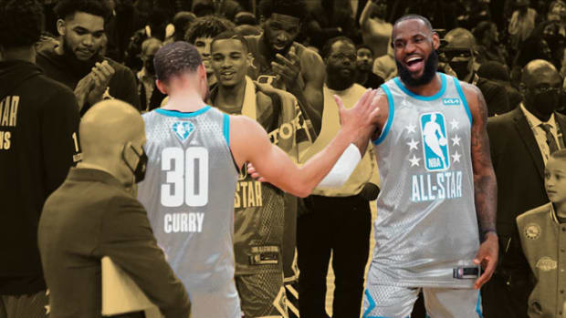 Team LeBron forward LeBron James shakes hands with Team LeBron guard Stephen Curry after the 2022 NBA All-Star Game