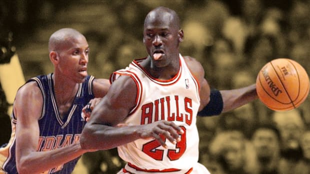 Chicago Bulls guard Michael Jordan guarded by Indiana Pacers guard Reggie Miller