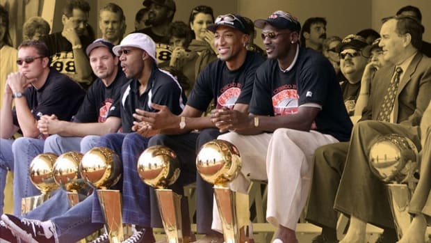 Chicago Bulls with their six championship trophies - Luc Longley, Toni Kukoc, Ron Harper, Scottie Pippen, and Michael Jordan