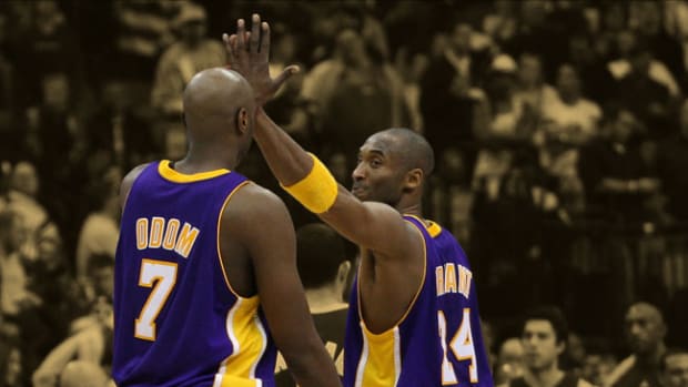 Los Angeles Lakers guard Kobe Bryant celebrates a victory with forward Lamar Odom