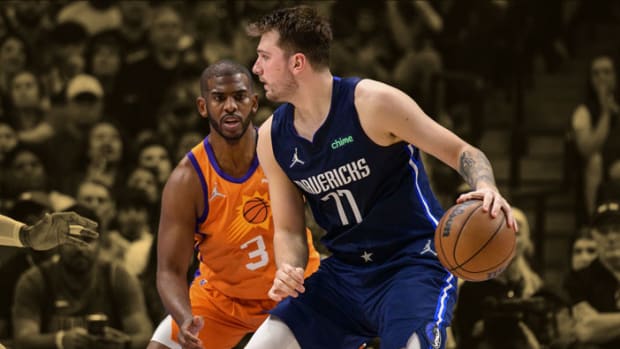 Phoenix Suns guard Chris Paul guards Dallas Mavericks guard Luka Doncic