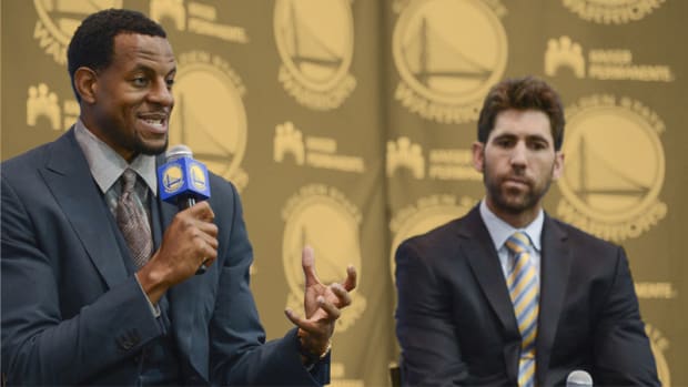 Golden State Warriors forward Andre Iguodala and general manager Bob Myers