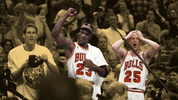 Chicago Bulls players Michael Jordan and Steve Kerr celebrate after winning the NBA championship after defeating the Utah Jazz in the 1997 NBA Finals at the United Center