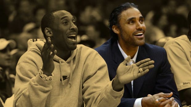 January 14, 2004; Kobe Bryant  and Rick Fox sit on the Lakers' bench at Staples Center.