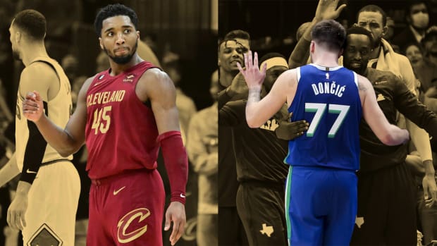Cleveland Cavaliers guard Donovan Mitchell and Dallas Mavericks forward Luka Doncic celebrate after their historic performances