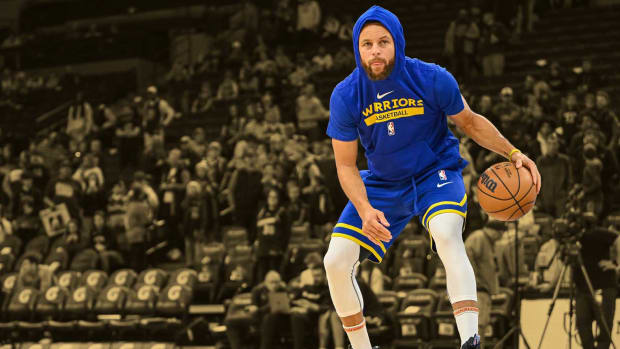 November 27, 2022; Golden State Warriors superstar Stephen Curry dribbles the ball during shoot around before a game against the Minnesota Timberwolves at Target Center