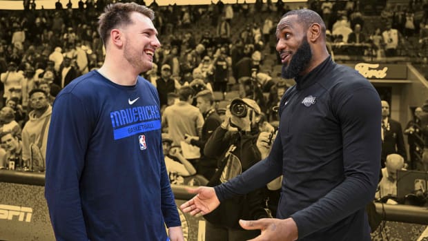 December 25, 2022; Luka Doncic with LeBron James following the Dallas Mavericks' win over the Los Angeles Lakers at American Airlines Center