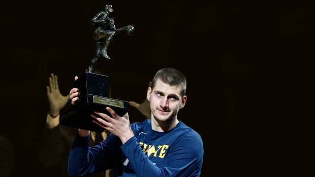 June 11, 2021; Denver Nuggets center Nikola Jokic lifts the NBA MVP award before the game against the Phoenix Suns during game three in the second round of the 2021 NBA Playoffs at Ball Arena