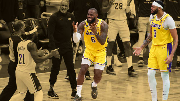 Los Angeles Lakers forward LeBron James (6) reacts with Anthony Davis