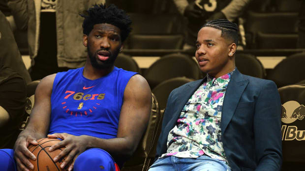 January 1, 2019; Philadelphia 76ers center Joel Embiid talks to Markelle Fultz on the bench before a game against the Los Angeles Clippers at Staples Center
