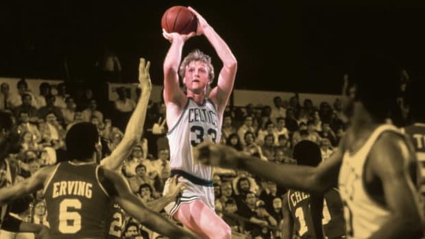 Boston Celtics forward Larry Bird attempts a jump shot against Philadelphia 76ers
