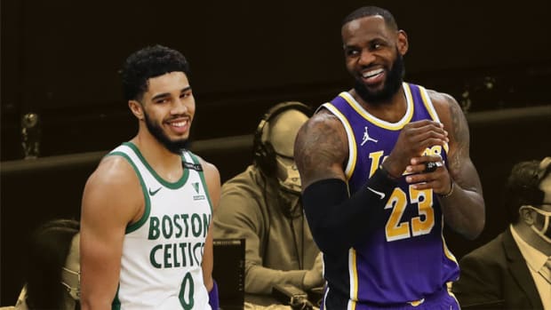 Los Angeles Lakers forward LeBron James shares a laugh with Boston Celtics forward Jayson Tatum