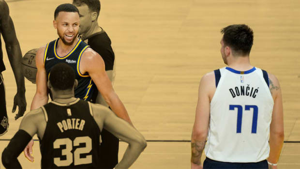 Golden State Warriors guard Stephen Curry and Dallas Mavericks guard Luka Doncic