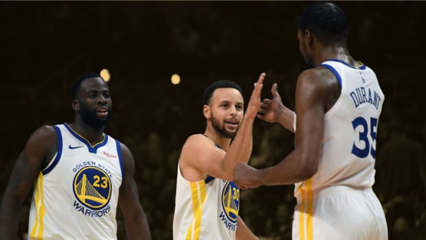 Golden State Warriors forward Draymond Green, guard Stephen Curry and forward Kevin Durant