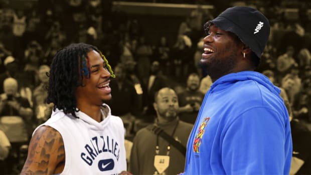 Memphis Grizzlies guard Ja Morant talks with New Orleans Pelicans forward Zion Williamson