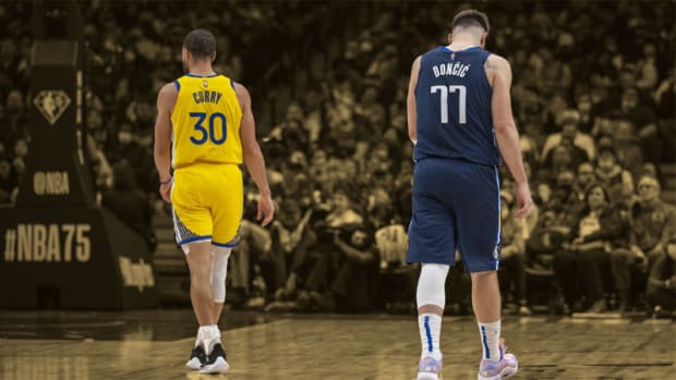 Golden State Warriors guard Stephen Curry and Dallas Mavericks guard Luka Doncic