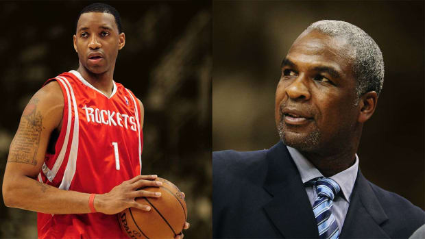 Houston Rockets forward Tracy McGrady and Charles Oakley