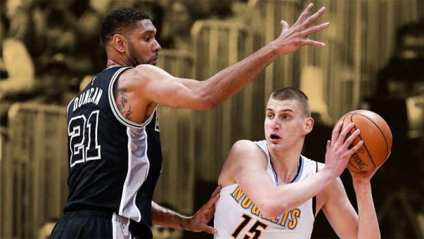 San Antonio Spurs center Tim Duncan guards Denver Nuggets center Nikola Jokic