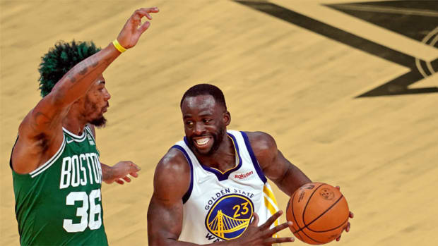 Golden State Warriors forward Draymond Green and Boston Celtics guard Marcus Smart