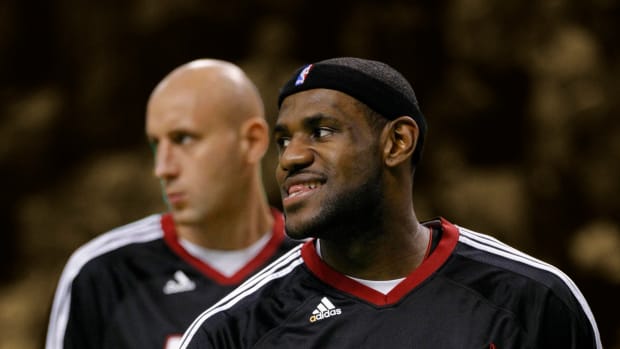 2010 Miami Heat teammates forward LeBron James and center Zydrunas Ilgauskas warm up before the start of the game against the Boston Celtics at the TD Garden.