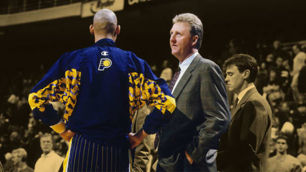 Indiana Pacers head coach Larry Bird talks to Reggie Miller