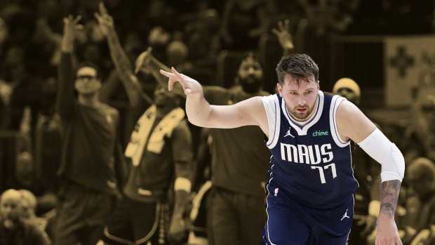 Dallas Mavericks guard Luka Doncic (77) reacts after scoring against the Chicago Bulls during the first half at United Center.