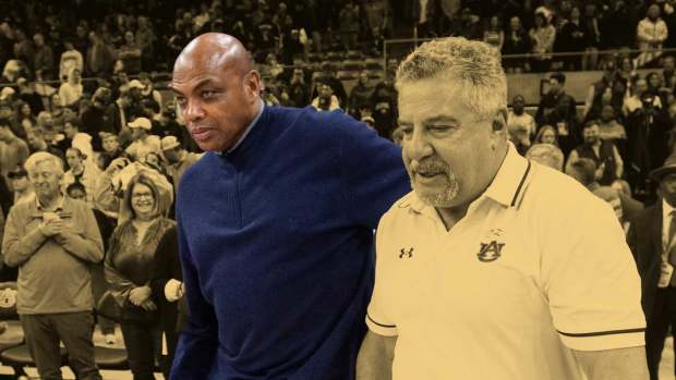 Former Auburn basketball player Charles Barkley and Auburn Tigers head coach Bruce Pearl take the court after the game as Auburn Tigers take on USC Trojans at Neville Aren