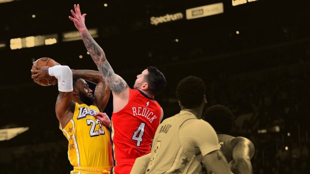  Los Angeles Lakers forward LeBron James (23) controls the ball against New Orleans Pelicans guard JJ Redick (4) 