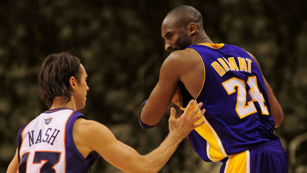 Los Angeles Lakers guard Kobe Bryant (24) looks down at Phoenix Suns guard Steve Nash (13)