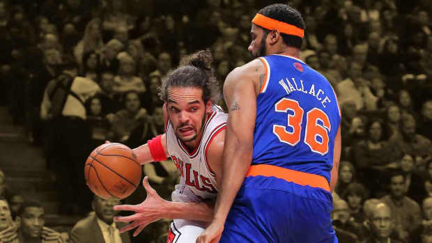 Chicago Bulls center Joakim Noah (13) drives against New York Knicks center Rasheed Wallace (36)