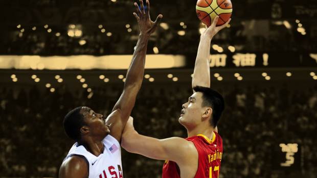 China center Yao Ming (13) shoots over USA center Dwight Howard (11)