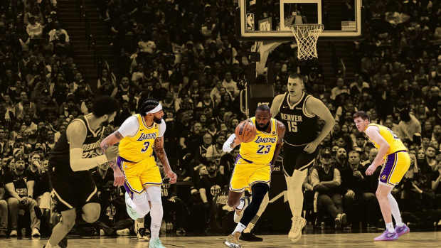 Los Angeles Lakers forward LeBron James (23) dribbles the ball up court ahead of Denver Nuggets center Nikola Jokic (15) as forward Anthony Davis (3) and guard Jamal Murray (27) defend in the first quarter during game five of the first round for the 2024 NBA playoffs at Ball Arena. 