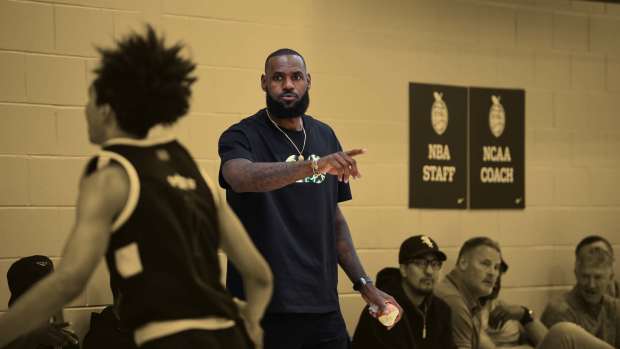 LeBron James yells from the sidelines during the Strive for Greatness and TSF game at the Peach Jam in Riverview Park Activities Center