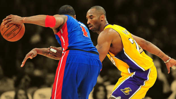 Los Angeles Lakers shooting guard Kobe Bryant (24) defends Detroit Pistons shooting guard Tracy McGrady (1)