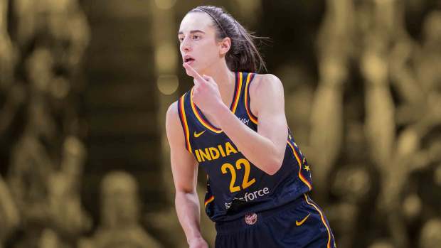 Indiana Fever guard Caitlin Clark (22) reacts to scoring three points