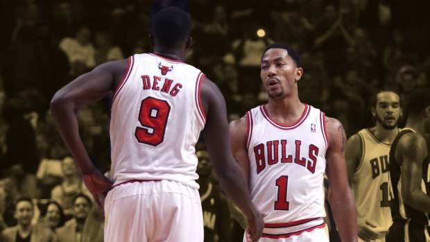 Chicago Bulls point guard Derrick Rose (1) is congratulated by small forward Luol Deng (9)