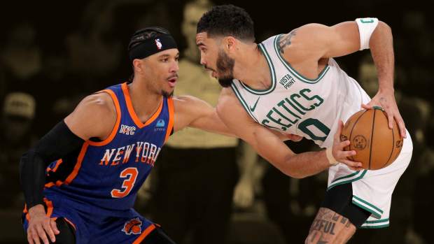 February 24, 2024; Boston Celtics forward Jayson Tatum against New York Knicks guard Josh Hart at Madison Square Garden