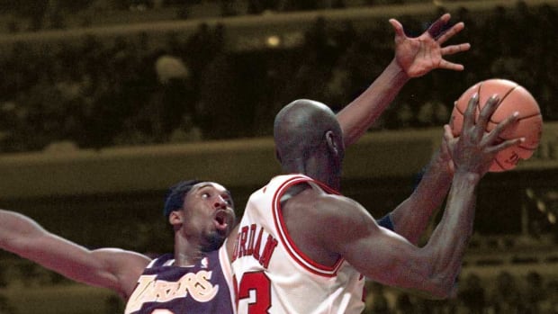Chicago, IL; LA's Kobe Bryant, left, tries to stop Chicago's Michael Jordan (23)