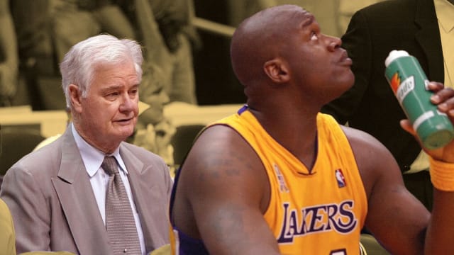 Los Angeles Lakers assistant coach Tex Winter sits behind the team bench during game 3 of the NBA Western Conference Finals at Staples Center. At right is center Shaquille O'Neal.