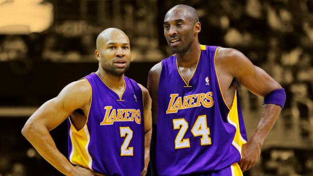 March 7, 2012; Washington, DC, USA; Los Angeles Lakers point guard Derek Fisher (2) talks with shooting guard Kobe Bryant (24)