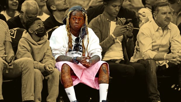 Artist Lil Wayne sits courtside during the second quarter in game seven of the second round for the 2022 NBA playoffs between the Dallas Mavericks and the Phoenix Sunsat