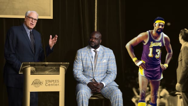 Phil Jackson speaks during ceremony to unveil statue of Los Angeles Lakers former center Shaquille O'Neal; Los Angeles Lakers center Wilt Chamberlain