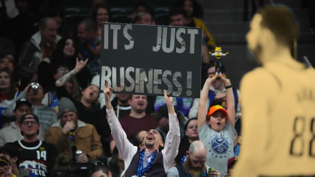 Denver Nuggets fan holds up a sign towards the Indiana Pacers