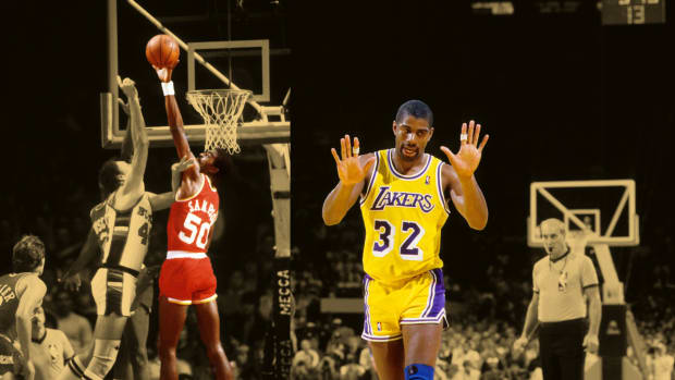 Houston Rockets center Ralph Sampson and Los Angeles Lakers guard Magic 
Johnson