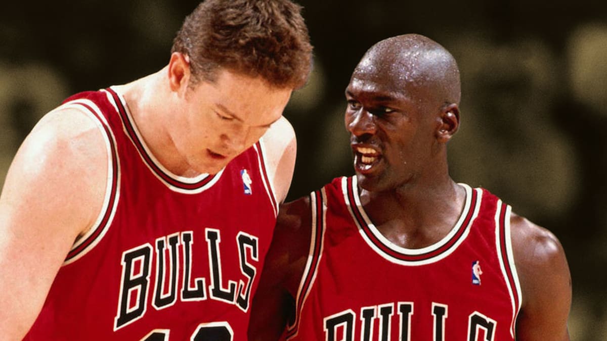 Chicago Bulls' Michael Jordan, left and Luc Longley, right, squeeze out  Charlotte Hornets' Alonzo Mourning during the third quarter of the Bulls'  103-80 win on Tuesday, May 2, 1995, in Chicago. The